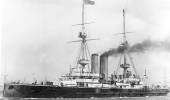 HMS Vengeance: "Underway in harbor, prior to the adoption of the overall gray warship color scheme by the Royal Navy in about 1904." (U.S. Naval Historical Center)