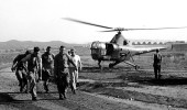 Navy corpsmen carry a wounded man from a U.S. Marine Corps HO3S-1 evacuation helicopter to a hospital in Korea on Oct. 3, 1950.