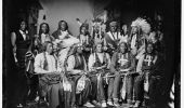 Chief Red Cloud (seated, second from left), Young Man Afraid Of His Horse (standing, second from left), and other Native Americans in a photo dated between 1860 and 1880.