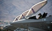 USAF Capt. Brad Matherne conducts preflight checks inside an F-35A Lightning II before a training mission April 4 at Nellis Air Force Base, Nev. (USAF)
